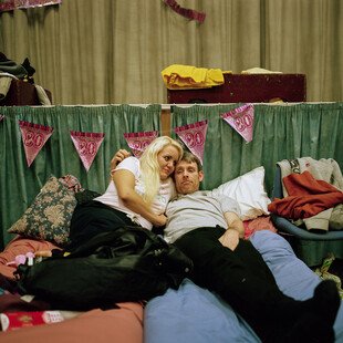 A man and woman lay on a bed in a local night shelter in Torquay.