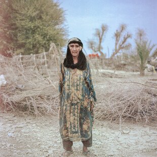 An old woman, said by her village to be over 100 years old, poses for a portrait.