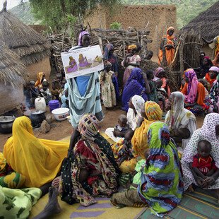 A health educator talks to women about mother and child healthcare in a village in Chad. 