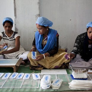 Women working at the Sanitary Pad Unit on the Amgoorie Tea Estate in Assam, India. 